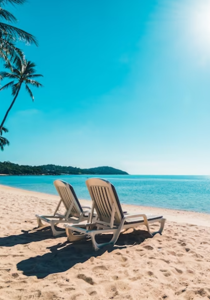 beautiful beach and sea with chair on blue sky